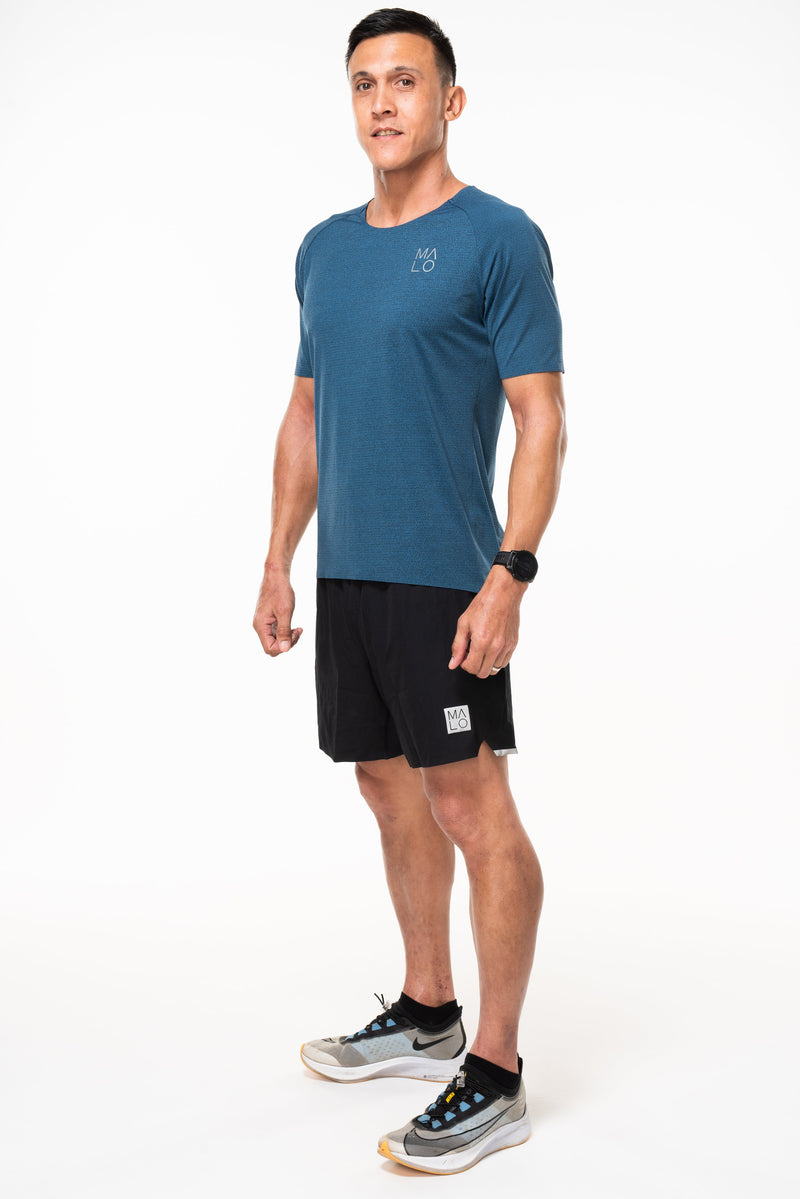 Left view of men's Spectrum Tee - Cobalt. Breathable deep blue workout tee. Sweat-wicking t-shirt.