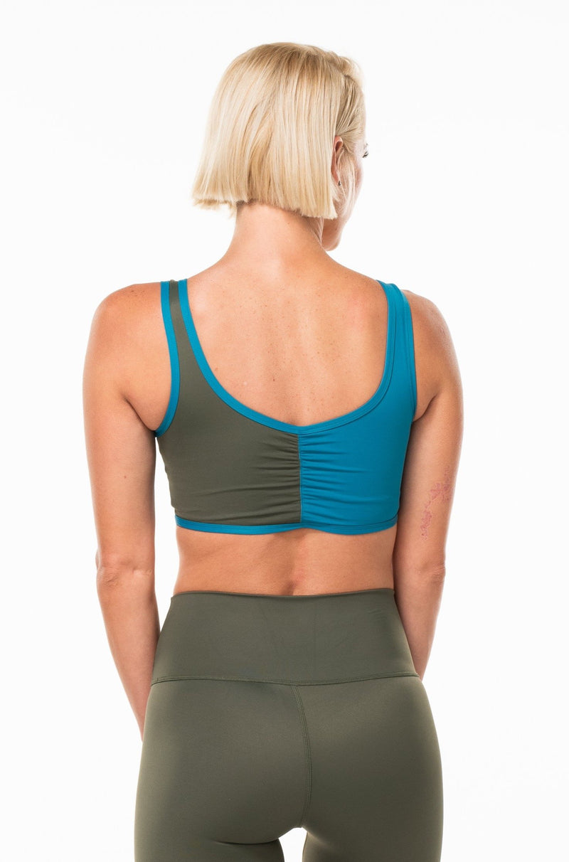 Back view of women's EcoActive reversible bralette - Seagrass/tidepool/panther. Blue and green sports bra.