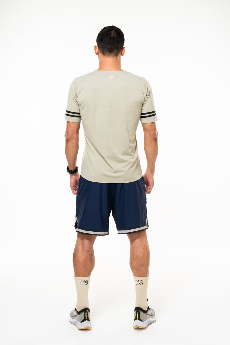 Back view of Men's Spectrum Tee. Tan running shirt. Technical short sleeve top to keep you cool.
