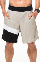 Men's Sand/Black Arvo Shorts. Tan shorts with white and black coloring on right leg. Unlined shorts with a 9.5" inseam.